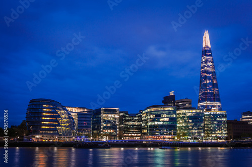 The Southwark skyline over the river Thames at night, London, United Kingdom