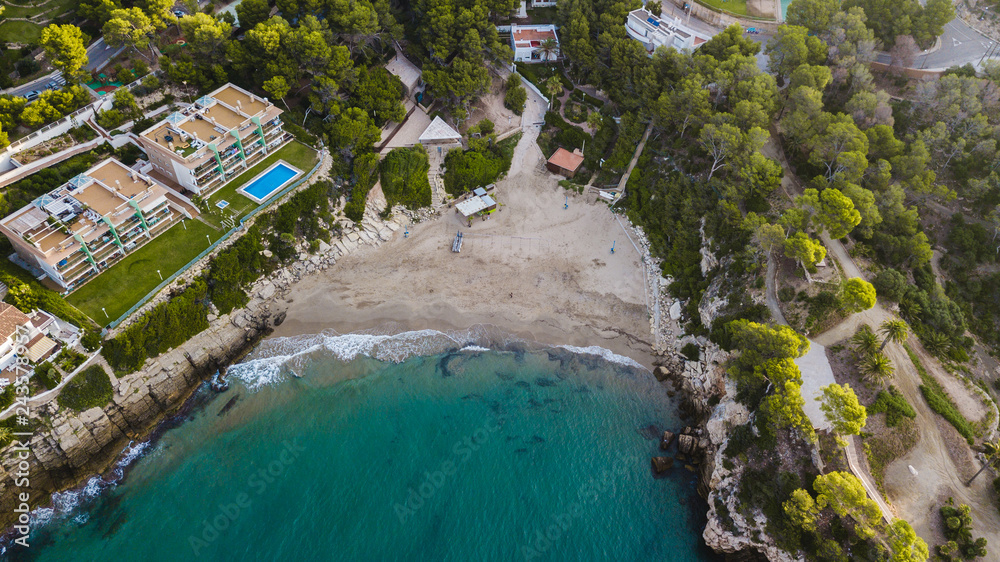 Salou beach in summer, Costa Daurada coastline in the sunrise. Travel destination in Spain for holidays. Aerial view of hotels and apartments close to the Mediterranean sea