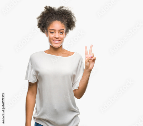 Young afro american woman over isolated background showing and pointing up with fingers number two while smiling confident and happy.