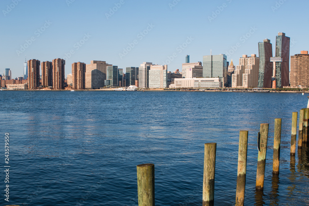 Pier in New York City - USA. Manhattan downtown skyline in the morning al view of New York City - USA. Manhattan downtown skyline and skyscrapers.