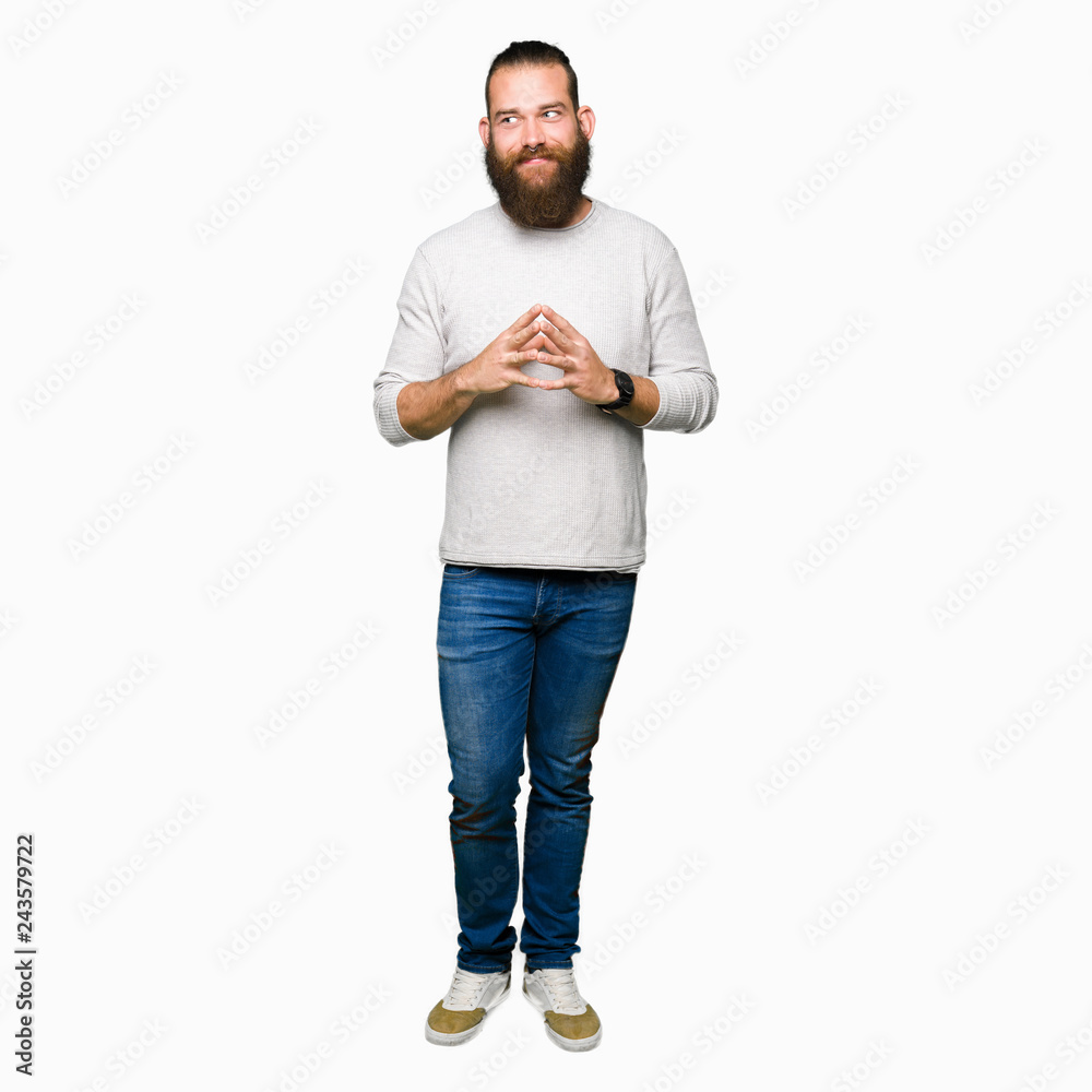 Young blond man wearing casual sweater Hands together and fingers crossed smiling relaxed and cheerful. Success and optimistic Young blond man wearing casual sweater Hands together and fingers crossed smiling relaxed and cheerful. Success and optimistic