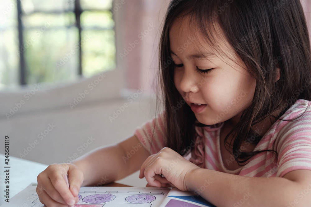 Young Asian girl drawing at home, homeschool education Young Asian girl drawing at home, homeschool education