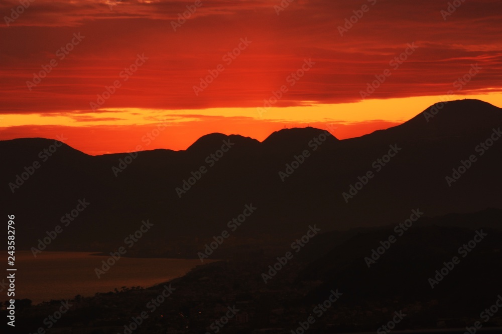 Afterglow of the sunset and silhouette of the mountains