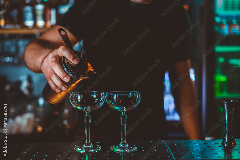 Cocktail Preparation. The barman is preparing a drink. Cocktail Preparation. The barman is preparing a drink.