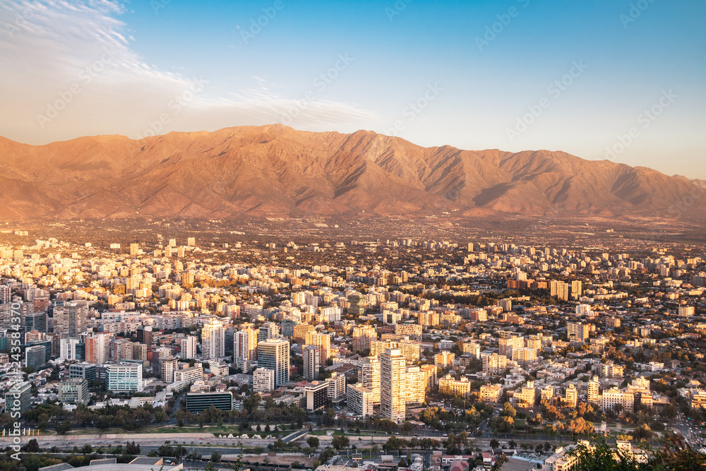 Fototapeta premium Aerial view of downtown Santiago and Andes Mountains at sunset - Santiago, Chile