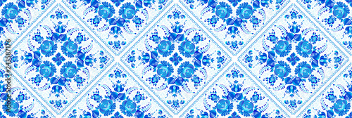 Blue geometrical seamless pattern with painted floral elements in ceramic tiles style