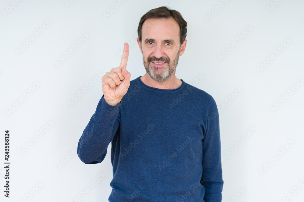 Elegant senior man over isolated background showing and pointing up with finger number one while smiling confident and happy. Elegant senior man over isolated background showing and pointing up with finger number one while smiling confident and happy.