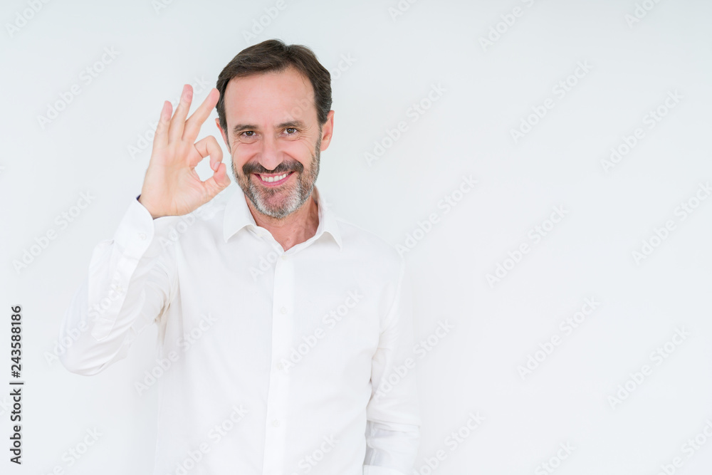 Elegant senior man over isolated background smiling positive doing ok sign with hand and fingers. Successful expression. Elegant senior man over isolated background smiling positive doing ok sign with hand and fingers. Successful expression.