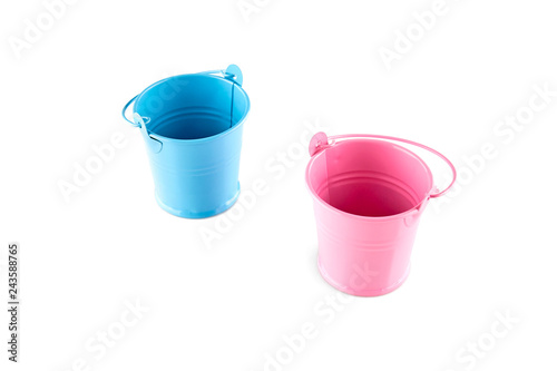 Small blue and pink buckets. Isolated on white background