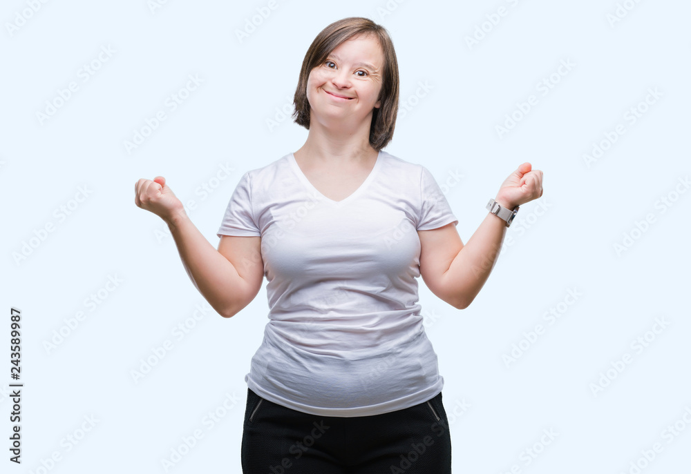 Young adult woman with down syndrome over isolated background celebrating mad and crazy for success with arms raised and closed eyes screaming excited. Winner concept Young adult woman with down syndrome over isolated background celebrating mad and crazy for success with arms raised and closed eyes screaming excited. Winner concept