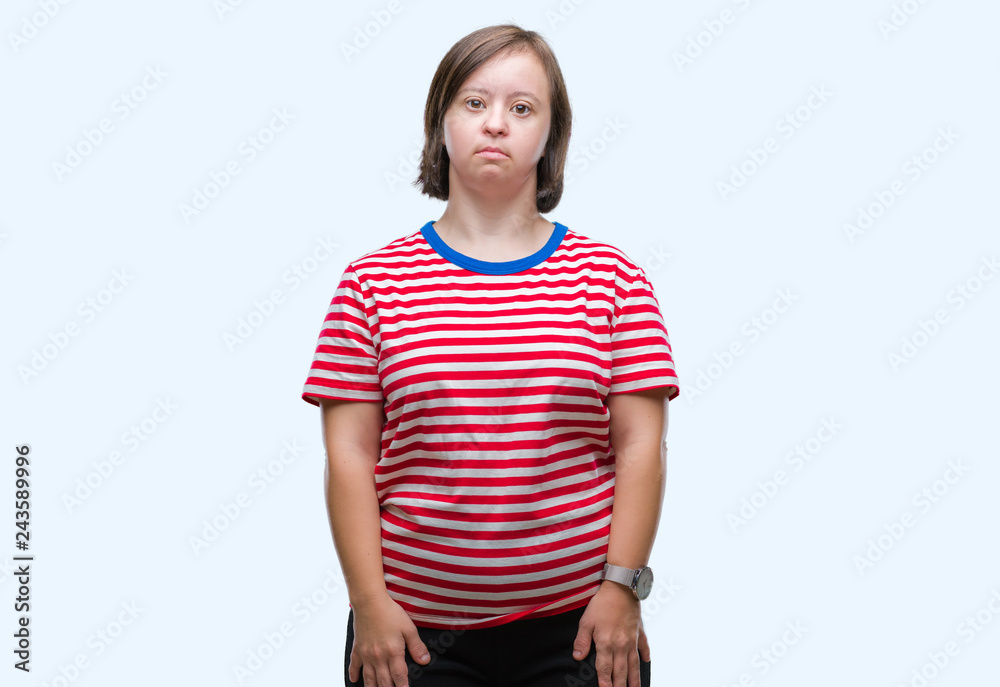 Young adult woman with down syndrome over isolated background with serious expression on face. Simple and natural looking at the camera. Young adult woman with down syndrome over isolated background with serious expression on face. Simple and natural looking at the camera.