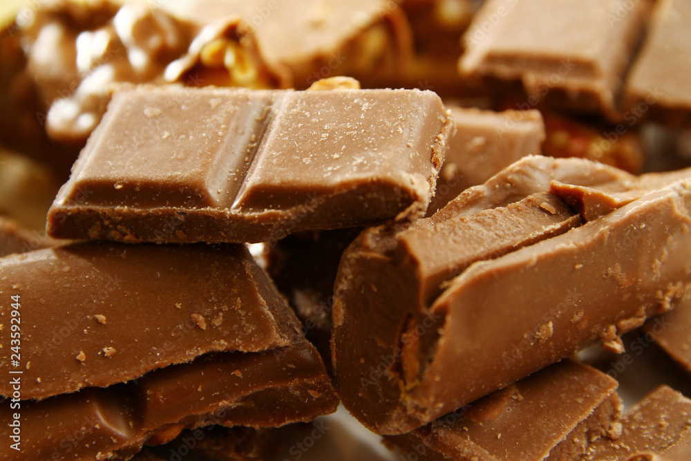 Chocolate background /Chocolate is a usually sweet, brown food preparation of roasted and ground cacao seeds Chocolate background /Chocolate is a usually sweet, brown food preparation of roasted and ground cacao seeds