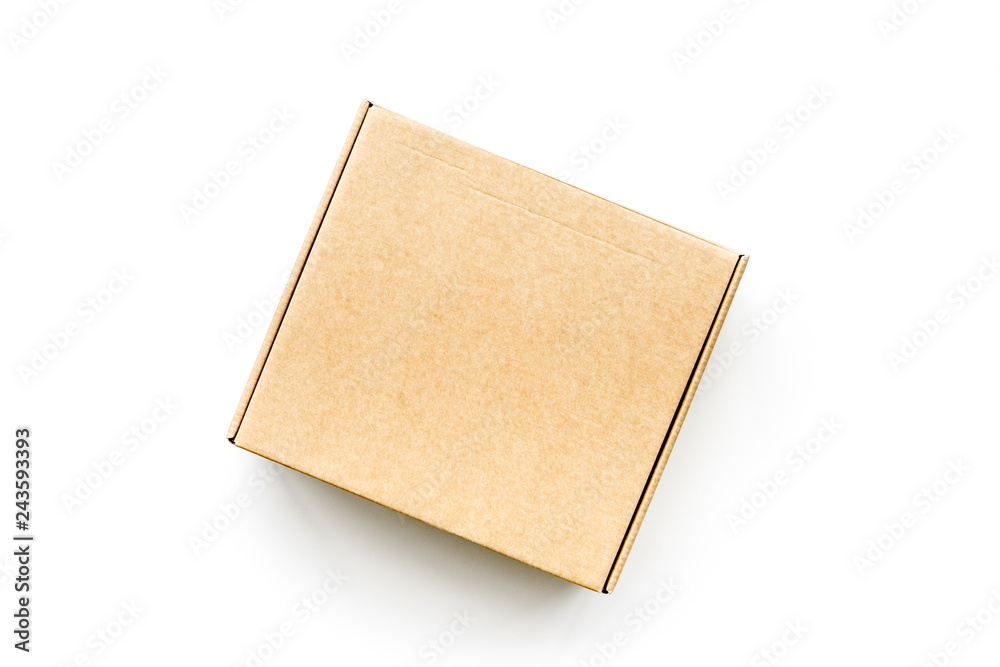 Delivery concept. Cardboard box on white background top view mockup Delivery concept. Cardboard box on white background top view mockup