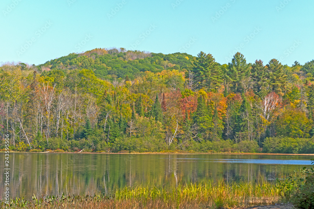 Fall Colors on a Forested Lake