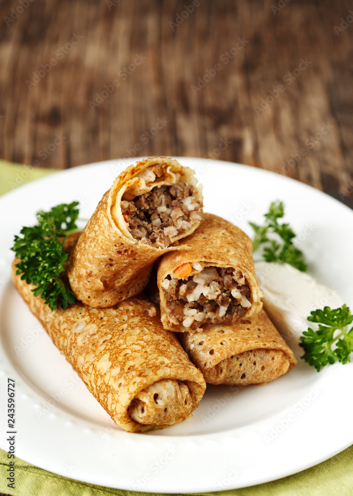 Crepes stuffed with meat and rice Crepes stuffed with meat and rice