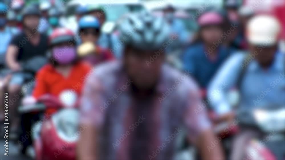 HO CHI MINH,  VIETNAM - CIRCA NOVEMBER 2018 : View of HEAVY RUSH HOUR TRAFFIC in blurred.  Many MOTORBIKE RIDERS on the busy road.
