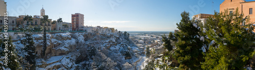 Panoramic View of the Gravina of the Town of Massafra, Covered by Snow on Blue Sky Background