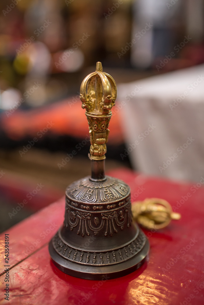 Buddhist religious equipment - Vajra Dorje and bell. Close up view in tibetan buddhist monastery in Ladakh Buddhist religious equipment - Vajra Dorje and bell. Close up view in tibetan buddhist monastery in Ladakh