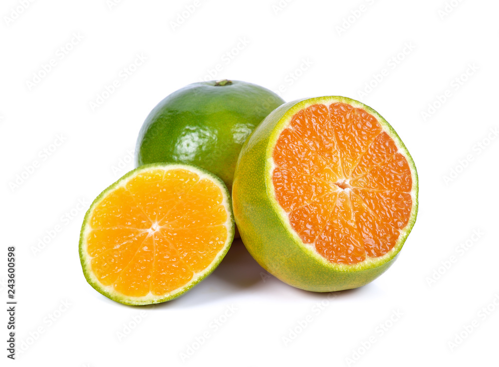Fresh green tangerine that gives high vitamin C, isolated from the white background Fresh green tangerine that gives high vitamin C, isolated from the white background
