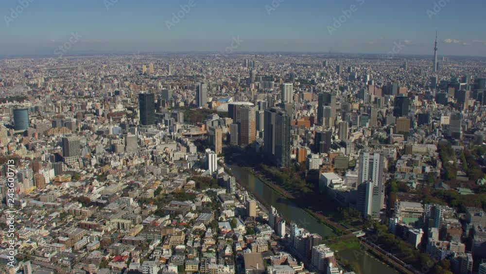 Tokyo, Japan circa-2018. Flying towards Tokyo Dome with Skytree in distance.  Shot from helicopter with RED camera.