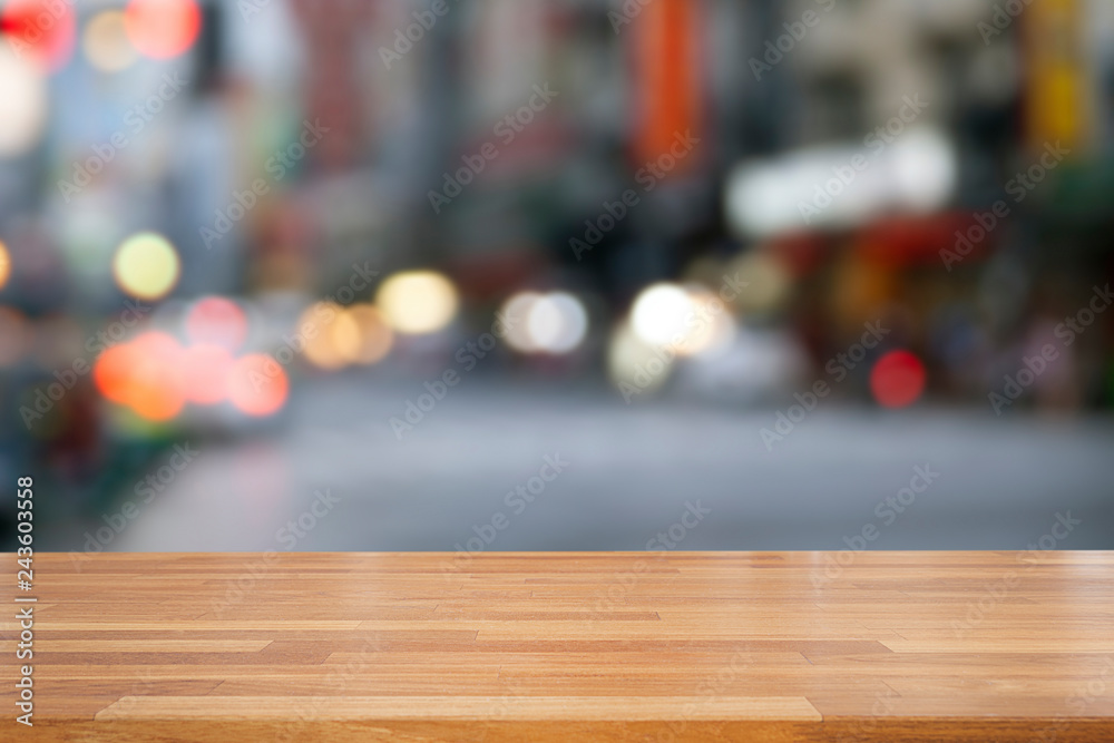 Empty wooden and table on abstract blurry building and street nightlife, city light abstract background, product display ,Ready for product montage