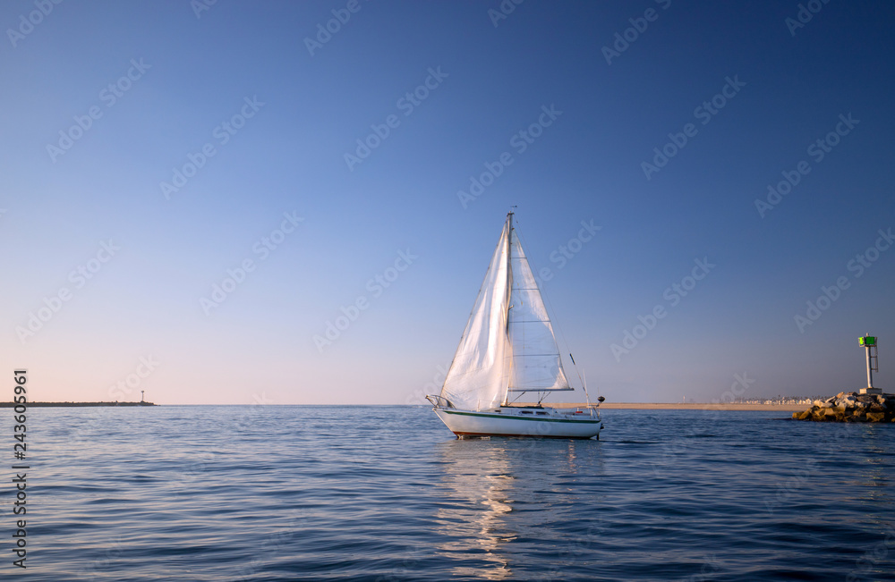 Recreational Sailboat leaving Channel Islands harbor in Oxnard California United States