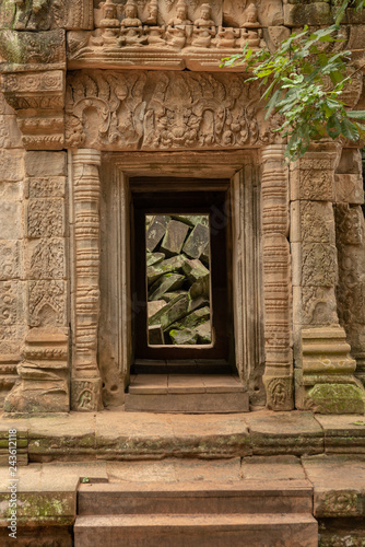 Fallen rocks seen through ruined temple doorway