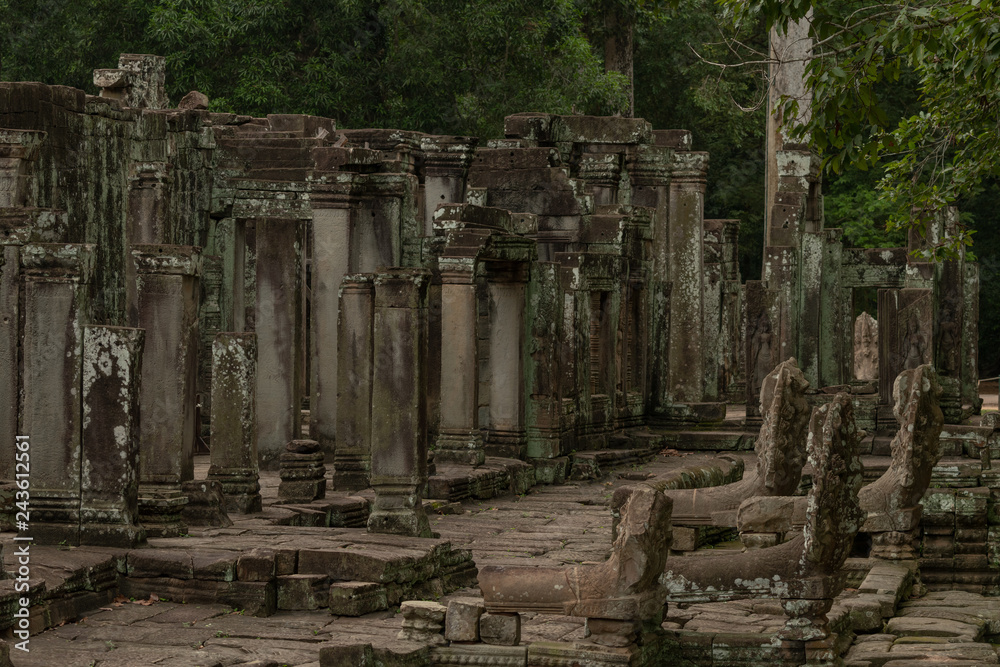Ruined columns of Bayon temple in forest