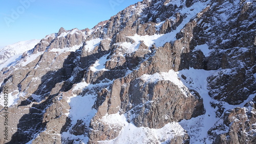 Huge Rocks Covered With Snow Ledges From The Snowy Mountains Cliffs And Large Rocks Dangerous Terrain Huge Rocks Covered With Snow Ledges From The Snowy Mountains Cliffs And Large Rocks Dangerous Terrain