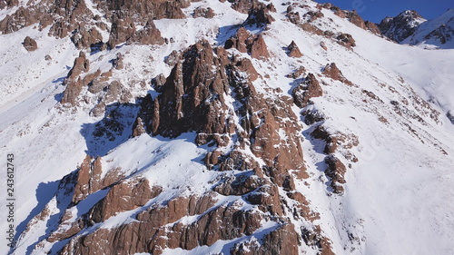 Huge Rocks Covered With Snow Ledges From The Snowy Mountains Cliffs And Large Rocks Dangerous Terrain Huge Rocks Covered With Snow Ledges From The Snowy Mountains Cliffs And Large Rocks Dangerous Terrain