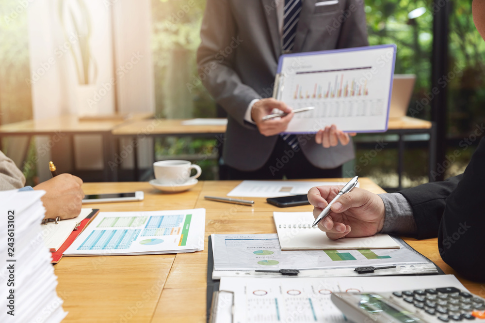 Business and finance concept of office working,Teamwork of Businessmen discussing investment business plan in office