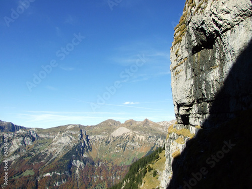 The rocks and stones of the Glarnisch and Vorder Glarnisch mountains above Lake Klontalersee - Canton of Glarus, Switzerland photo