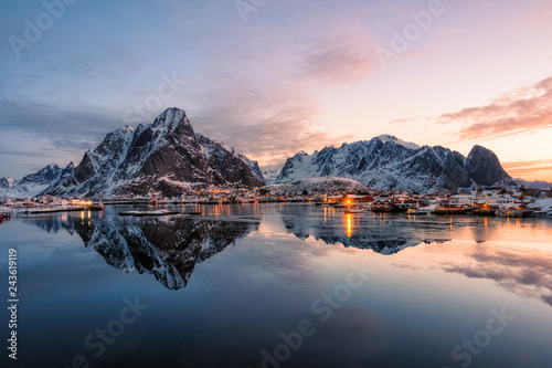 Fishing village with snow mountain at sunrise © Mumemories