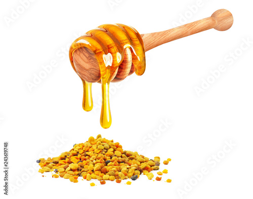dripping honey and bee pollen isolated on white