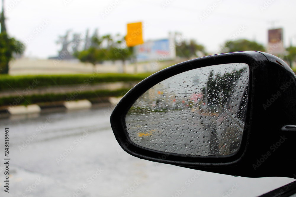Side mirror of a car with raindrops. Winter weather in Israel, heavy rain Side mirror of a car with raindrops. Winter weather in Israel, heavy rain