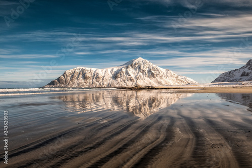 Snow mountain with sand furrows on Skagsanden beach