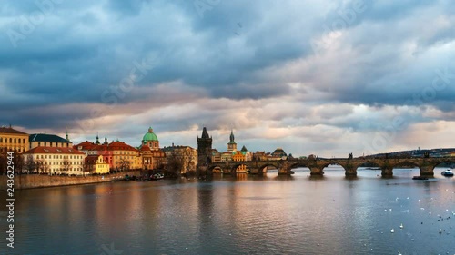Wallpaper Mural Prague, Czech Republic. Charles Bridge over Vltava river in Prague, Czech Republic. Timelapse during the sunset with touristic boats and Old Town Bridge Tower. Cloudy, day to night timelapse, zoom in Torontodigital.ca