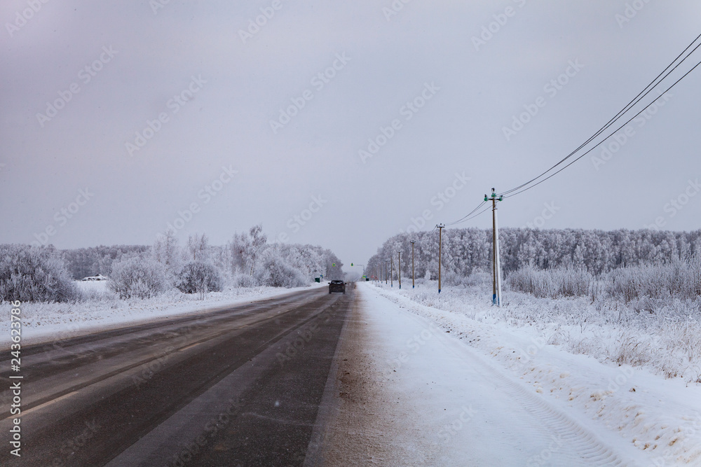 Country road after a snowfall in winter.