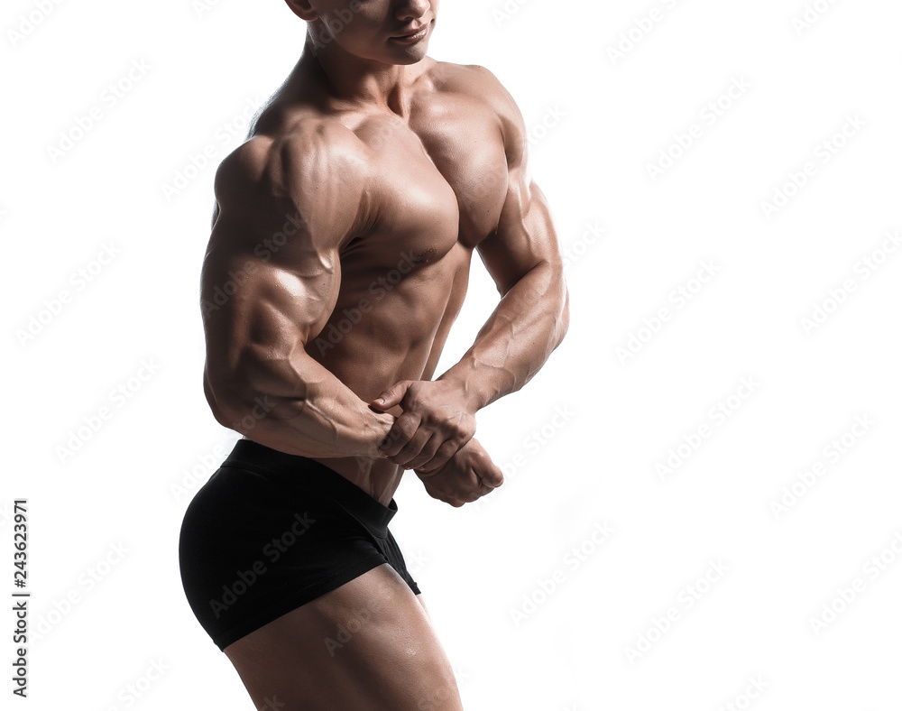 Handsome power athletic man pumping up muscles isolated over white. Strong bodybuilder with perfect shape body and six pack, abs, shoulders, biceps, triceps and chest. Handsome power athletic man pumping up muscles isolated over white. Strong bodybuilder with perfect shape body and six pack, abs, shoulders, biceps, triceps and chest.
