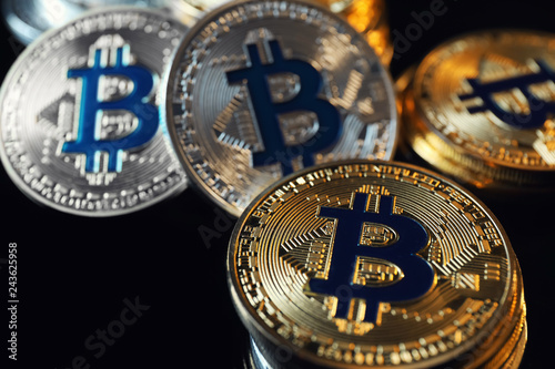 Bitcoins on black background, closeup