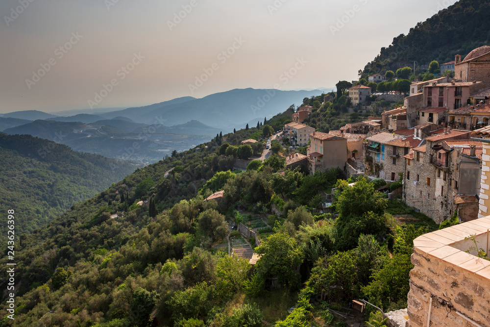 View across the valley towards the sea from a terrace in Peille, southeastern France.