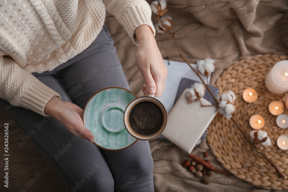 Young woman drinking hot coffee at home Young woman drinking hot coffee at home