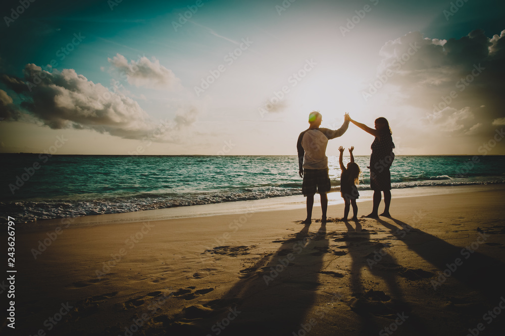 Fototapeta premium happy family with kids play at sunset beach