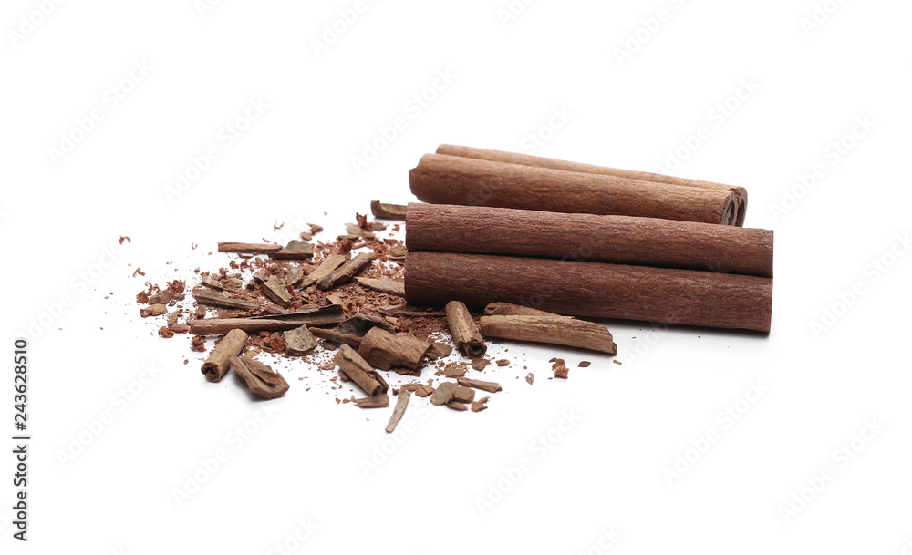 Cinnamon sticks with powder and shavings, macro isolated on white background Cinnamon sticks with powder and shavings, macro isolated on white background