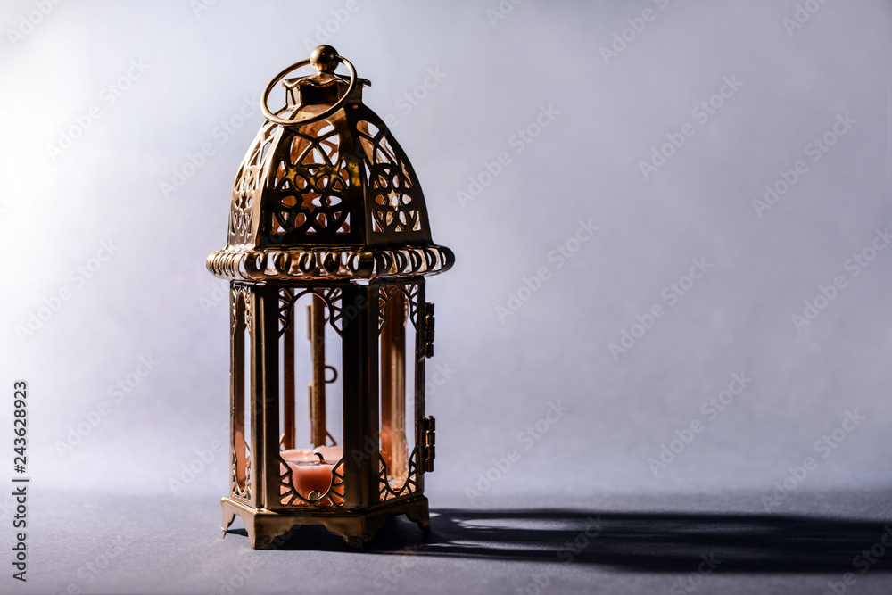 Muslim lamp as Ramadan symbol on grey background Muslim lamp as Ramadan symbol on grey background