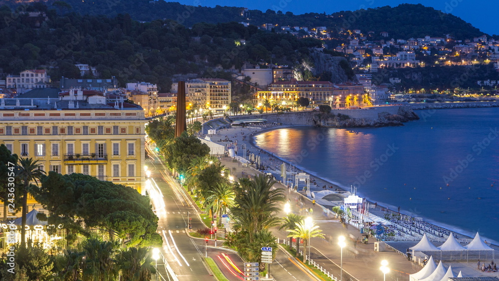 Evening aerial panorama of Nice day to night timelapse, France. Lighted Old Town little streets and waterfront after sunset