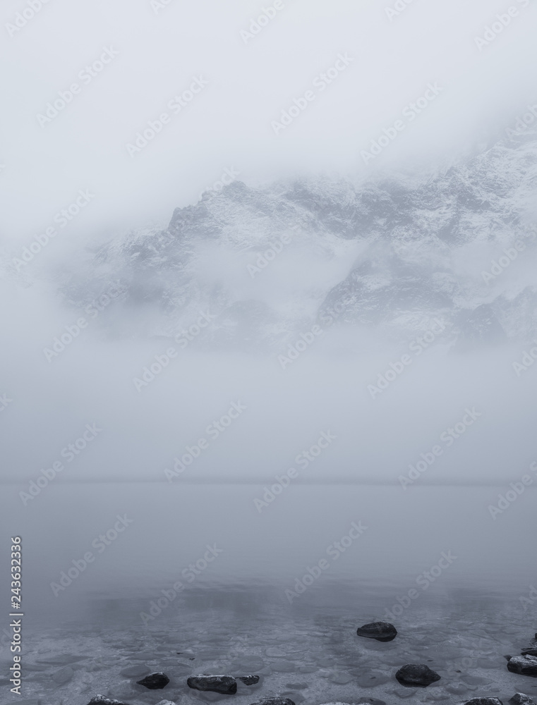 Fog over mountain lake