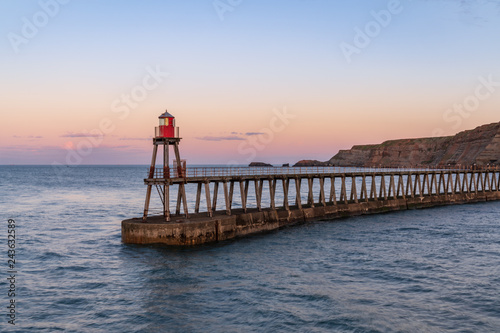 Whitby, North Yorkshire, England, UK - the East Pier, seen from the West Pier