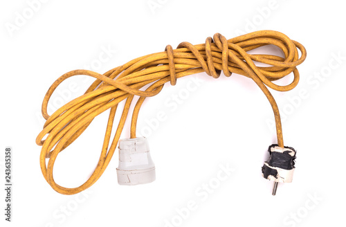 Yellow extension cord isolated on white photo