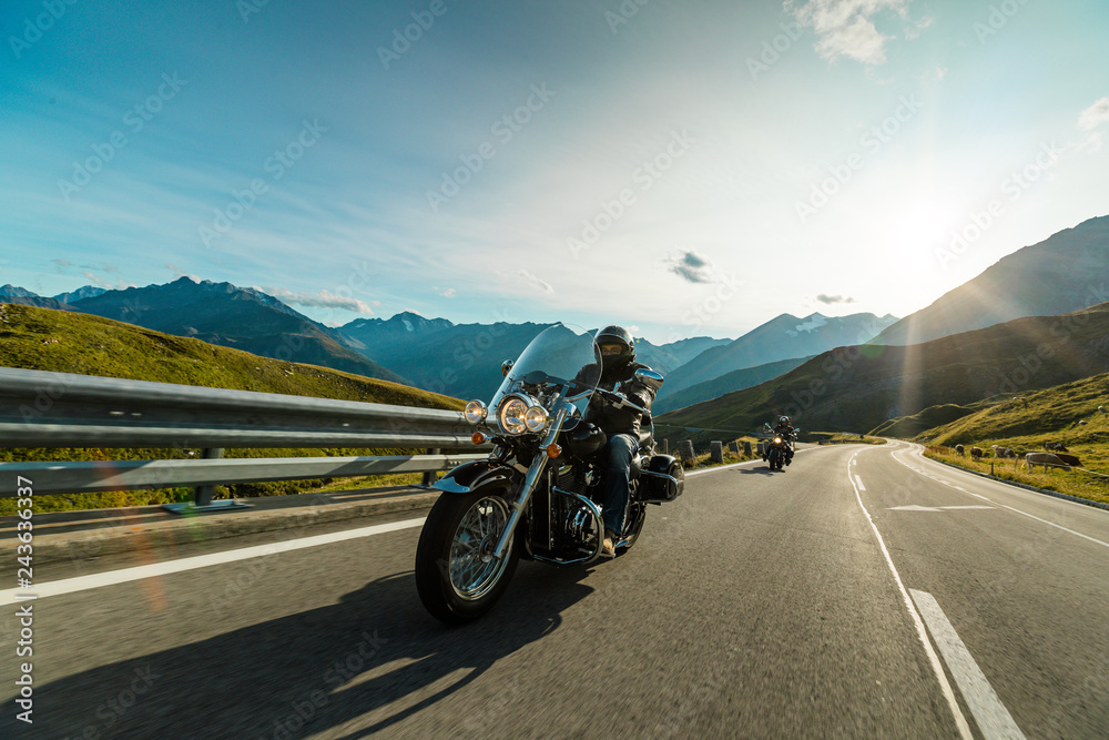 Fototapeta Motorcycle driver riding in Alpine highway, Hochalpenstrasse, Austria, Europe.